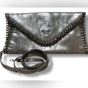 GUESS Silver Snake-Embossed Envelope Clutch with Chain Trim and crossbody strap
